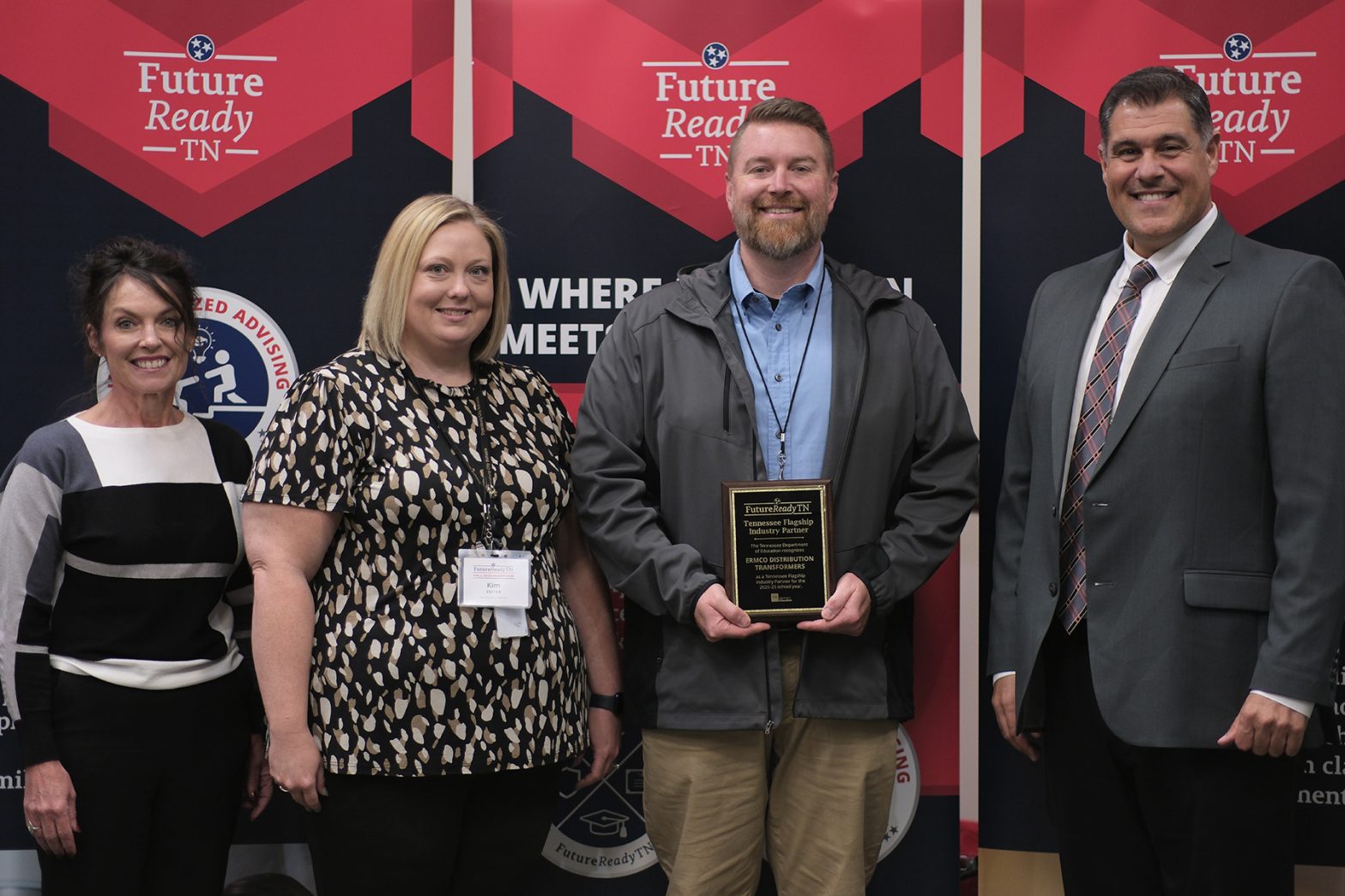 A photo of ERMCO employee Brad Whittle accepting Tennessee Department of Education's Flagship Industry of the Year Award